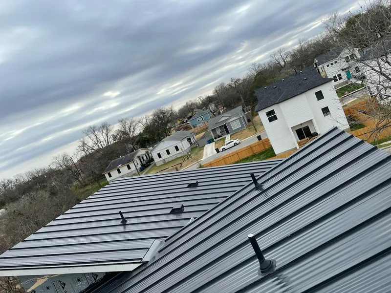 Standing seam metal roof panels with vents for Skylight Repair in Blaine